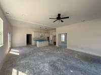 Laminate wood flooring in all areas downstairs excluding bathrooms and laundry.