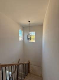 Landing separating the staircase.