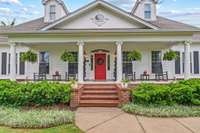 Impressive front porch on this stunning home.  Thoughtful construction with every detail considered along with simple, classic spaces for easy living.