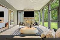 Screened Porch with fireplace.  Outdoor TV remains!