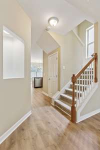 Display alcove and stairs to landing and second floor