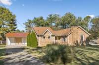 Owners added 40L x 24D x 14H pole barn with 2-10x10 roll up doors