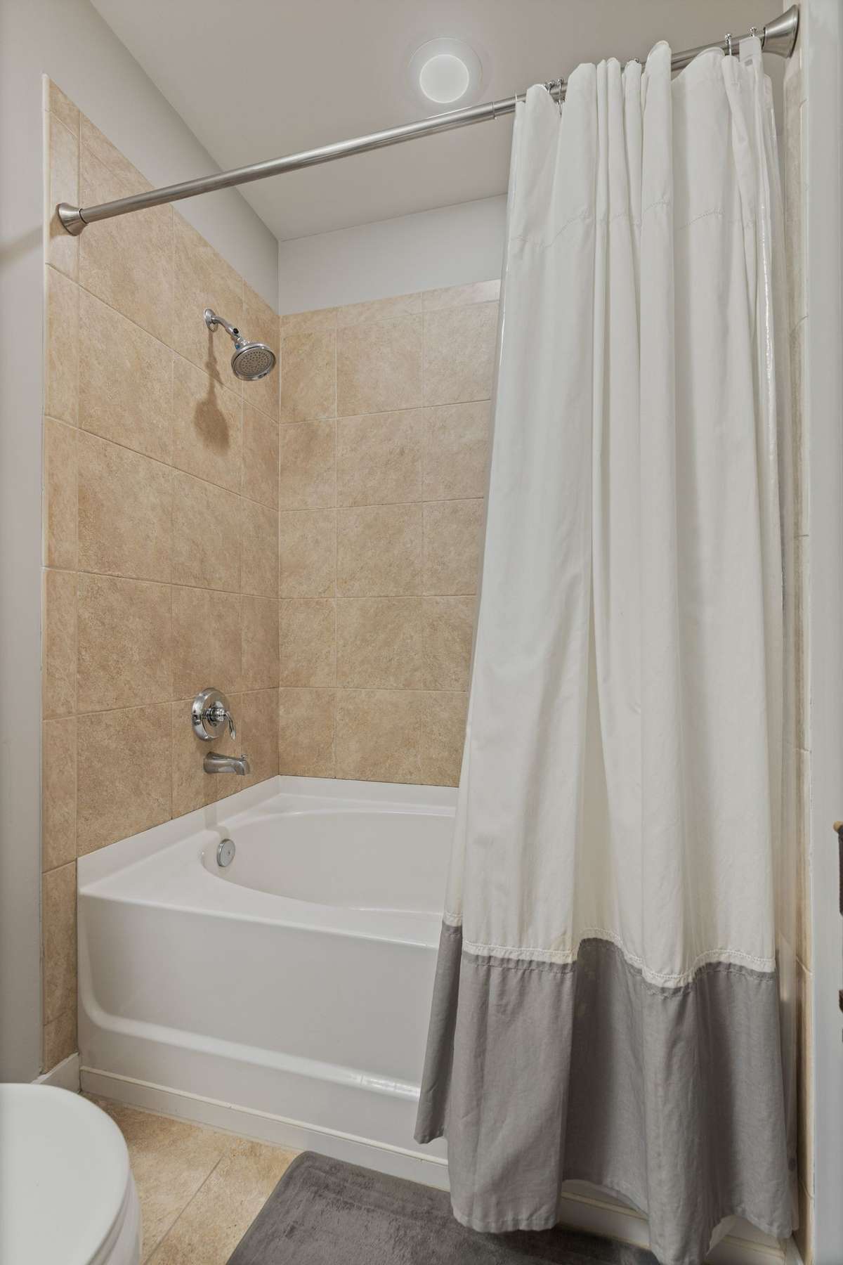 Ceramic tile surrounds tub
