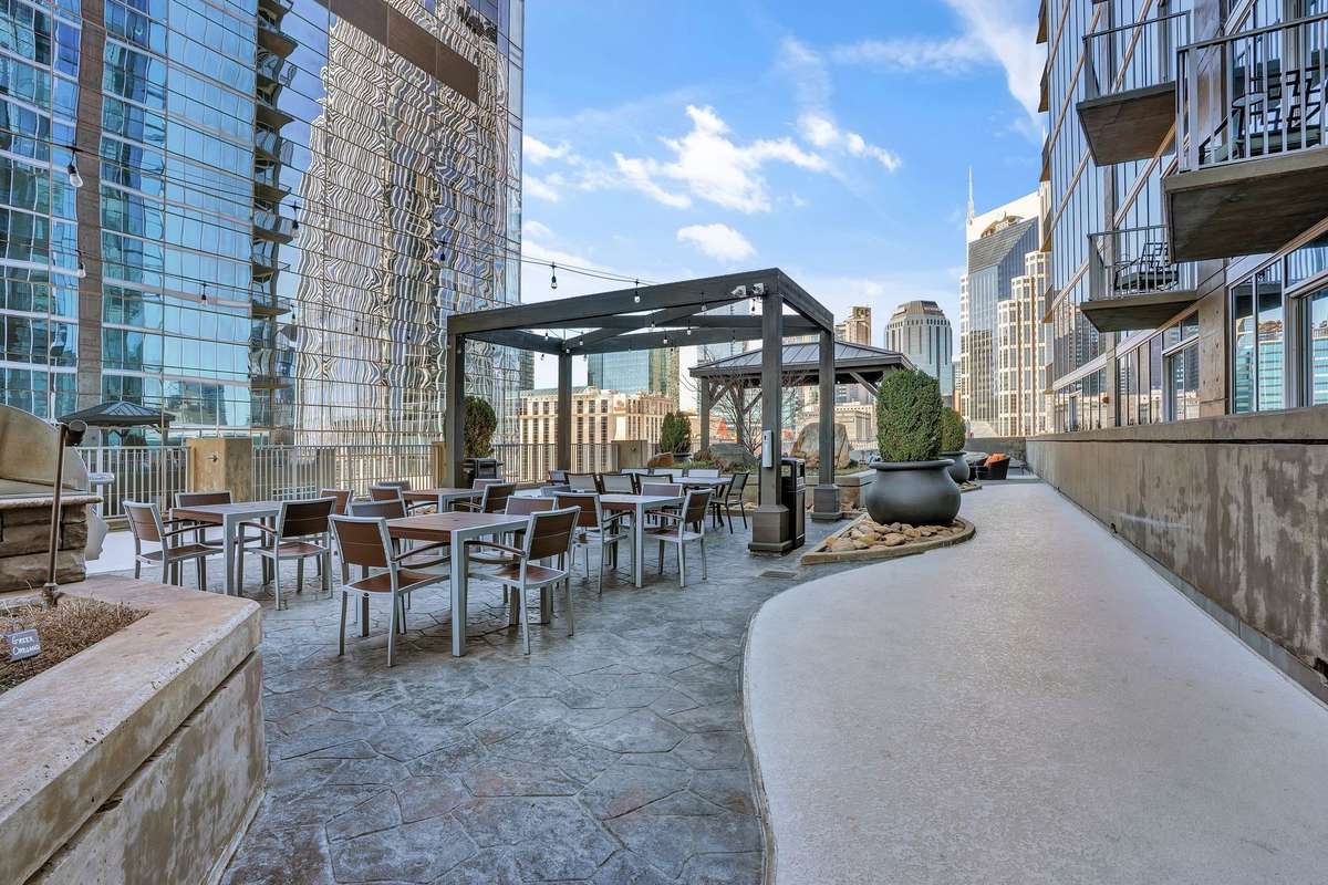 Condo offers an outdoor gathering and grilling area