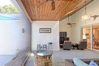 The screening can be open and closed easily with remote that is provided. Gas firepit conveys with house.