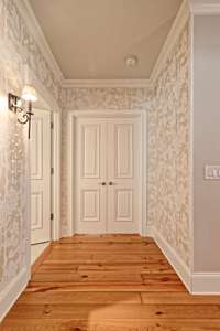 Double doors lead to Primary suite and also the guest bedroom.