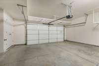 Insulated garage door with storage racks built in