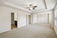 Another view of your spacious primary bedroom with a neutral color scheme, large closet, & private bathroom. 4014 Cannonsgate Ln Murfreesboro TN 37128