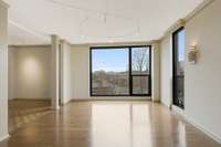 Just off the main living room is a secondary living space that welcomes in West facing light, and is a great place to catch a sunset view.