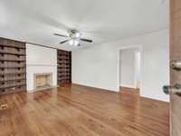 Living room w/ built in bookshelves