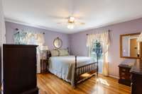 Bedroom 2 with hardwood floors and walk-in closet