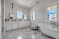 Huge primary bathroom with beautiful soaking tub, large shower and separate water closet.