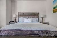 Primary suite, tons of space with a balcony for morning hangs with coffee