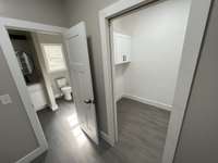 Standing in master closet. Access to laundry with pocket door.