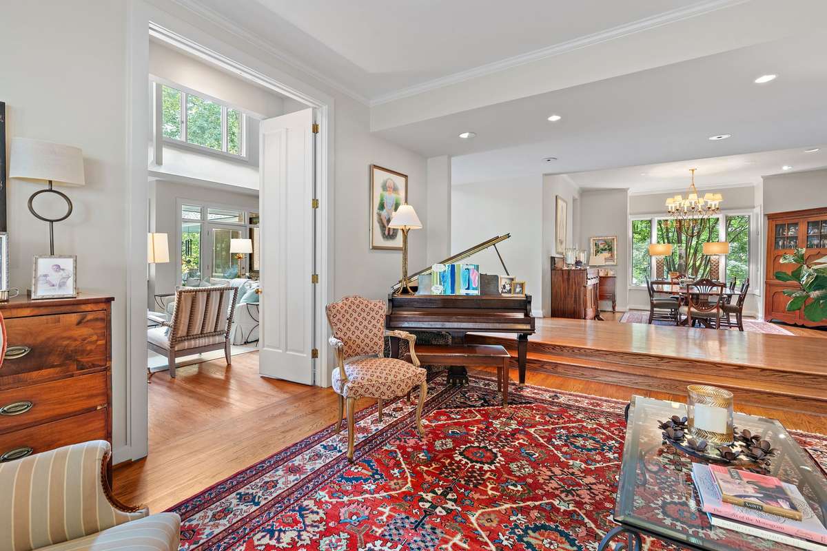 The formal living room can be closed off with 9-foot solid wood double doors