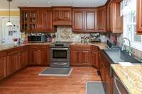 Hardwood Floors & Stainless Steel Appliances & Farm Style Sink!