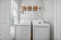 Photo of similar home in the same community. Laundry room on main level.