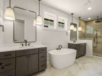 This primary bathroom is STUNNING with seperate vanities, soaking tub and a HUGE shower