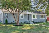 New landscaping, mature trees provide much needed curb appeal!