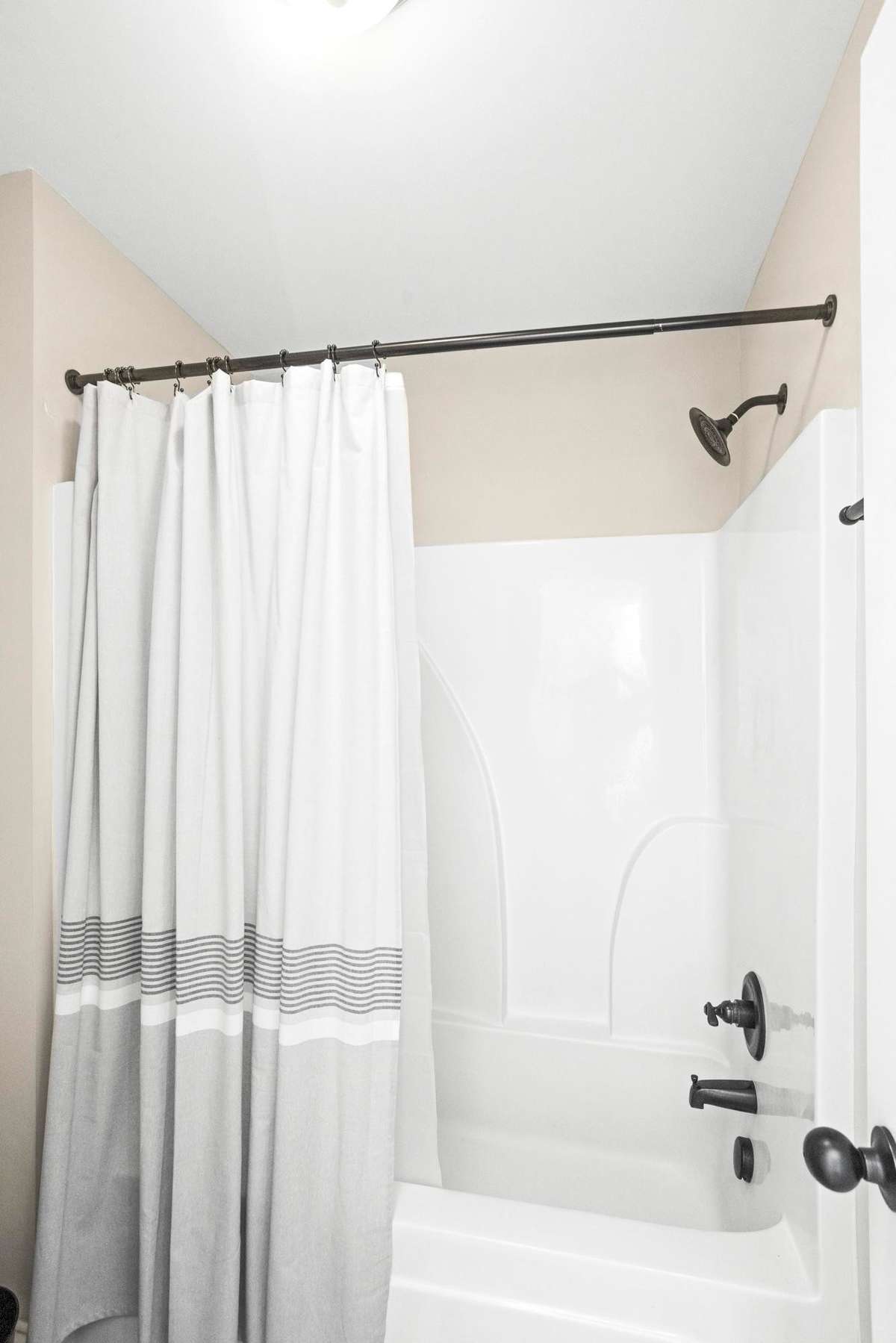 The upstairs bath is conveniently located near bedrooms 3 and 4.