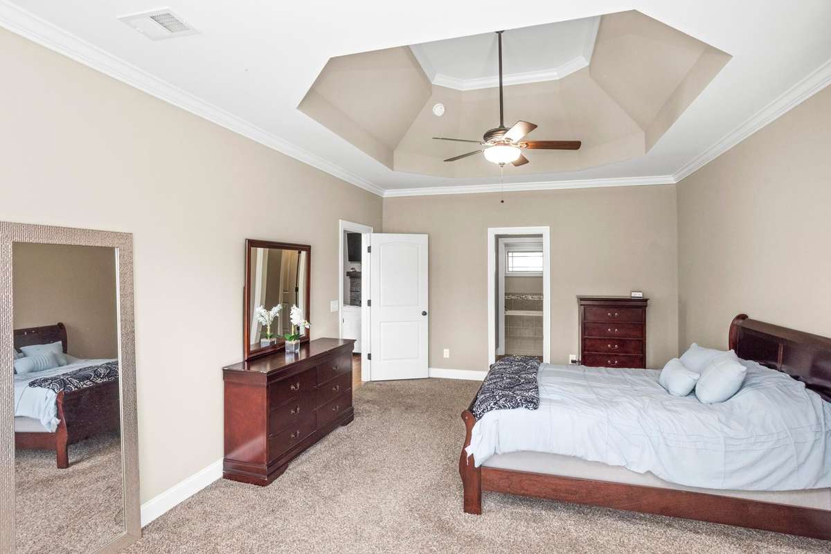 The primary bedroom is located just off the living room. This could be a great match for someone with a large set of bedroom furniture!