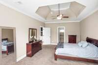 The primary bedroom is located just off the living room. This could be a great match for someone with a large set of bedroom furniture!