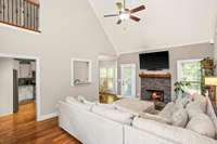 The cafe window and spacious doorways allow quick access between the living room and kitchen.