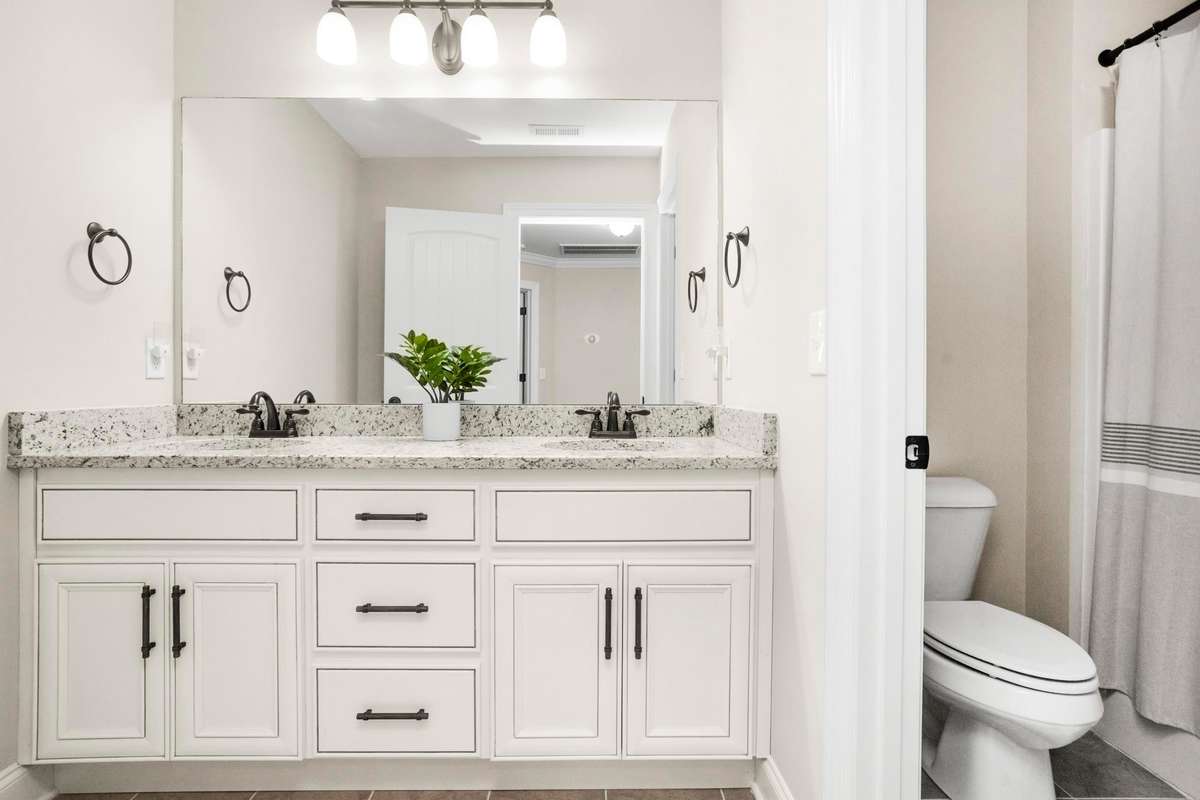 The large upstairs bath features double vanities and a tub/shower combo.