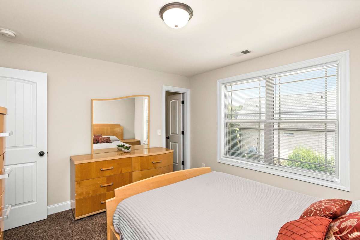 Bedroom 3 features a large walk-in closet and walkable attic storage access.