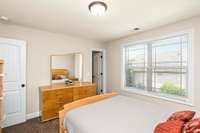 Bedroom 3 features a large walk-in closet and walkable attic storage access.