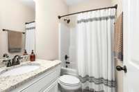 Bath 2 is located downstairs.  Accessible for guests and just down the hall from bedroom 2.