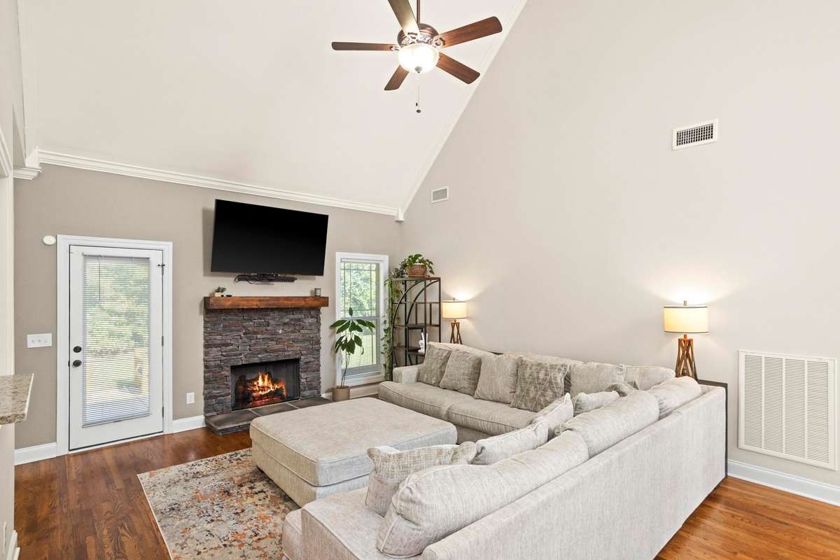The back patio is located just off the living room, convenient to kitchen and dining areas.