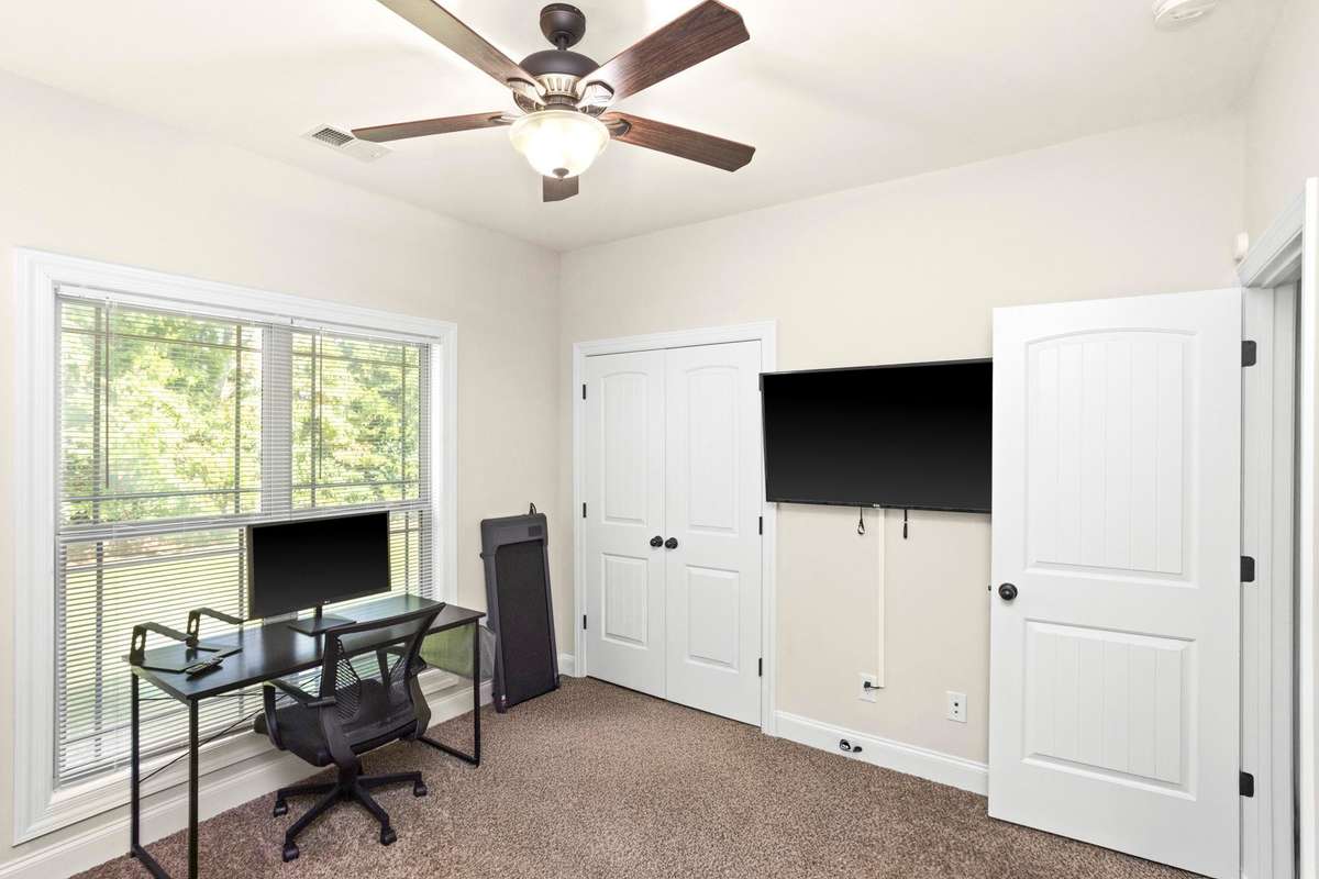 Bedroom 2 located downstairs is currently being used as an office/flex space.