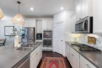 A dream kitchen- tons of storage space, huge island, gas range, double ovens, walk in pantry