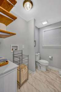 Hall Bathroom has Washer and Dryer Hookup.  Built in shelves