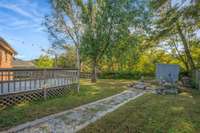 Walk way to Firepit Area in Backyard