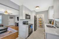 New Kitchen Cabinets with soft close drawers and doors.  New Upgraded Quartz Countertops in Kitchen.  Stove, Microwave, Dishwasher and Refrigerator all remain.  Pantry area in Back of Kitchen