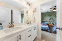 Double vanities and a tub/shower combo for the Jack & Jill bathroom off the two additional bedrooms