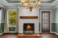 Dining room or cozy den off kitchen with wood burning fireplace