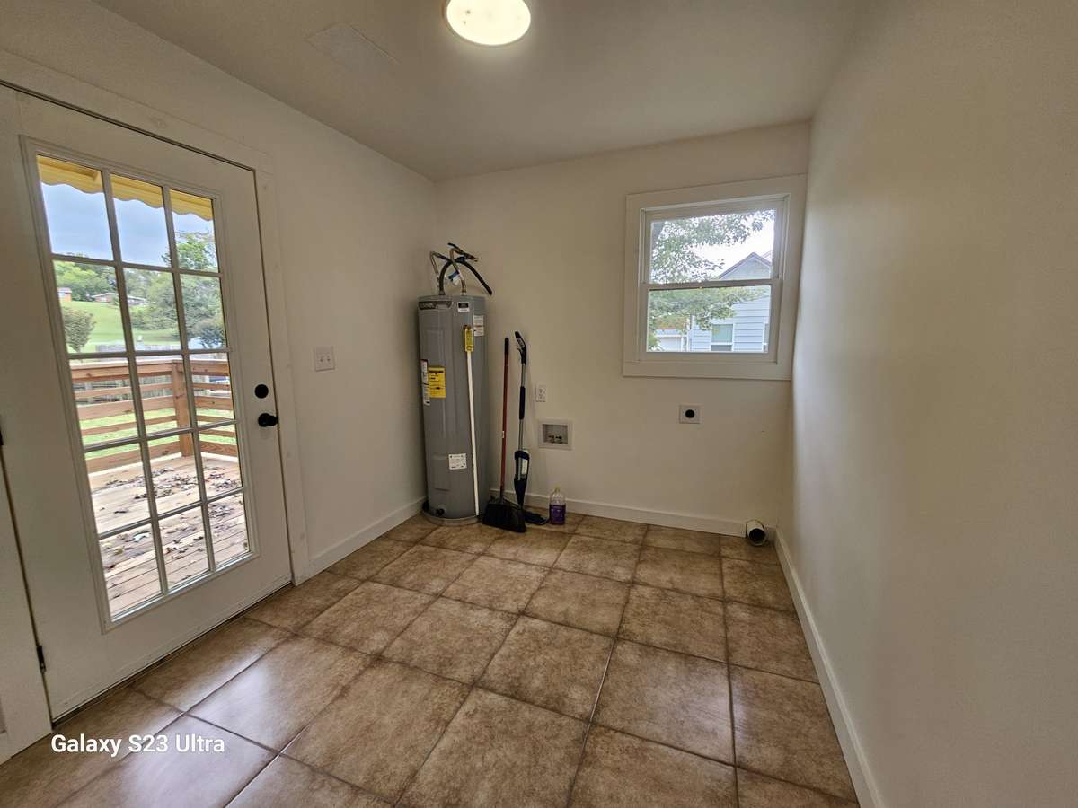 Laundry room in back