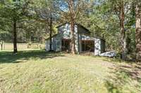 barn, attached to fenced pasture land