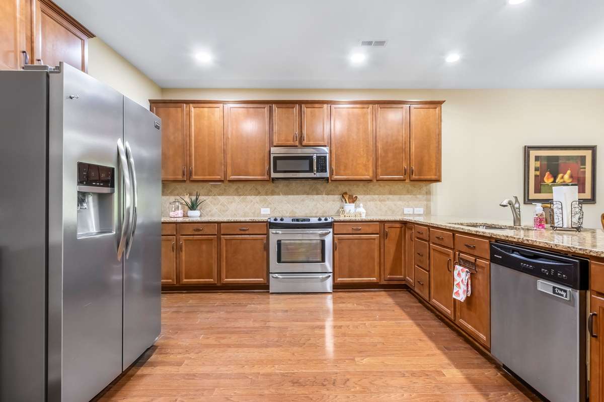Modern convenience, ample storage and countertops galore...This kitchen is sure to inspire your creative side!