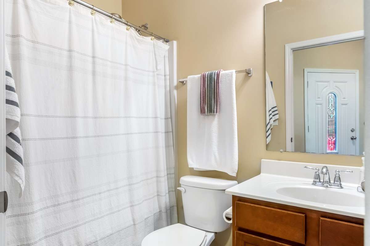 Experience low-maintenance luxury — a bathroom that feels as refreshing as it looks. Located directly across from the guest bedroom.