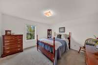 Secondary bedroom nearest the kitchen and living room at the front of the house. Overlooks the front yard.