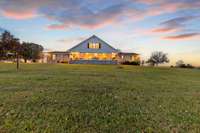 Twilight view of the back of the house.