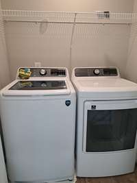 Brand new washer and dryer in laundry room upstairs.