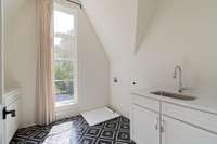 Second full laundry room with sink upstairs