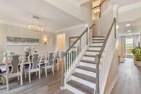 View of the Beautiful Hardwood Stair Case and Formal Dining Room