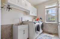 Laundry Room is located on the main level and has a utility sink
