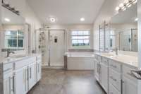 Primary Ensuite features his and her vanities, large soaking tub and Separate shower, Bidet does not convey.